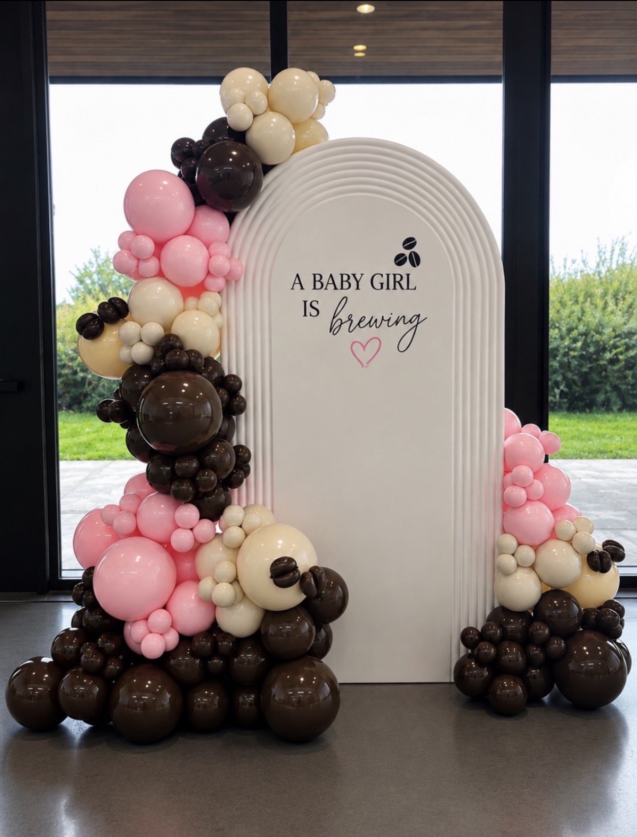 PartywithMY ripple backdrop with pink, cream and chocolate balloons for A Baby Girl Is Brewing